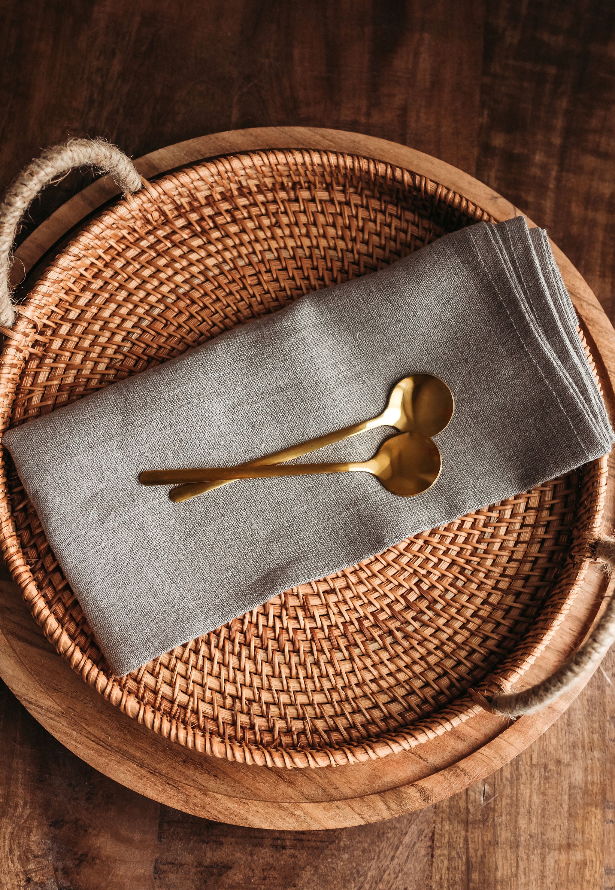 Top view of golden coffee side spoons on a linen cloth