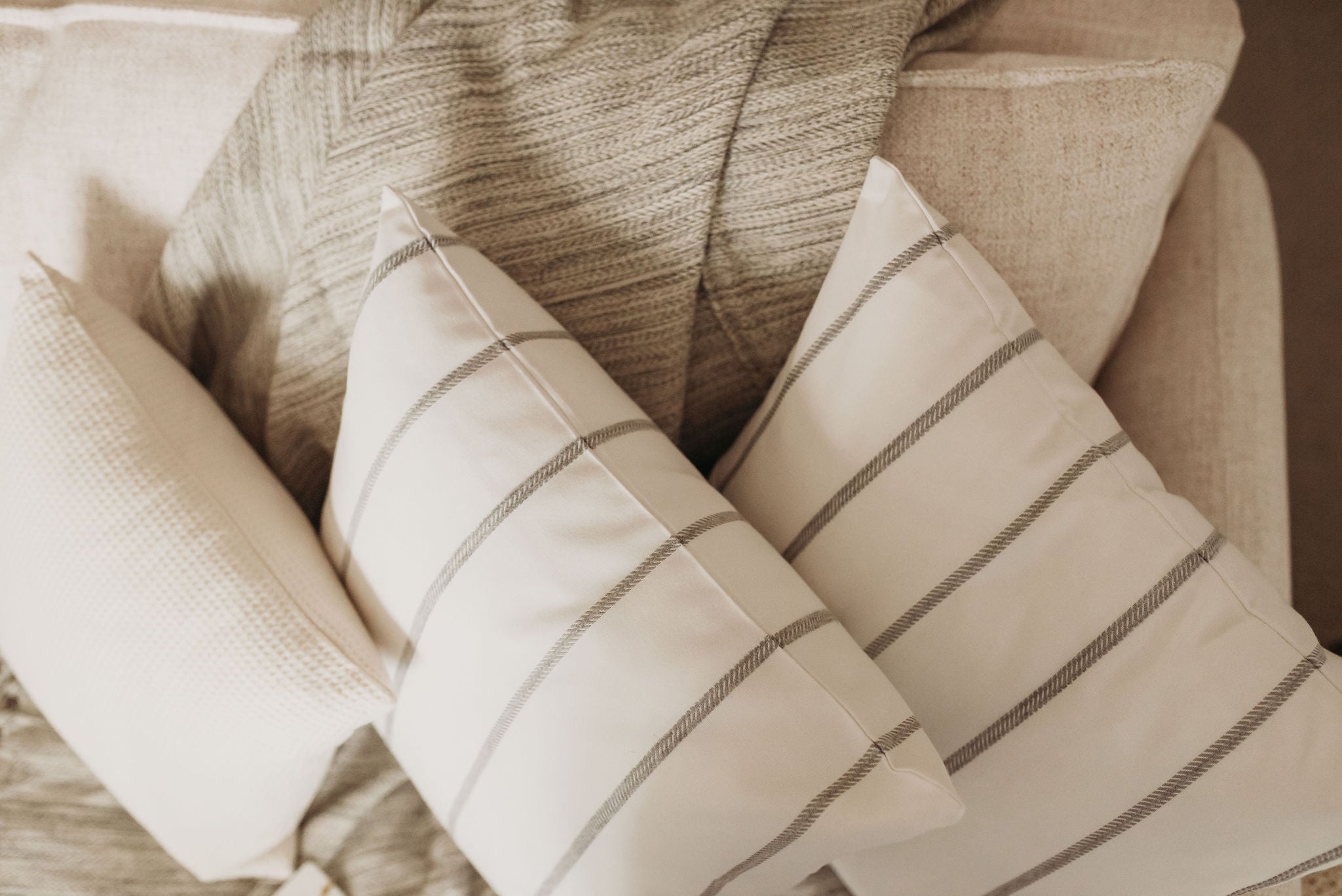 A pair of Embroidered Stripe Accent Pillows