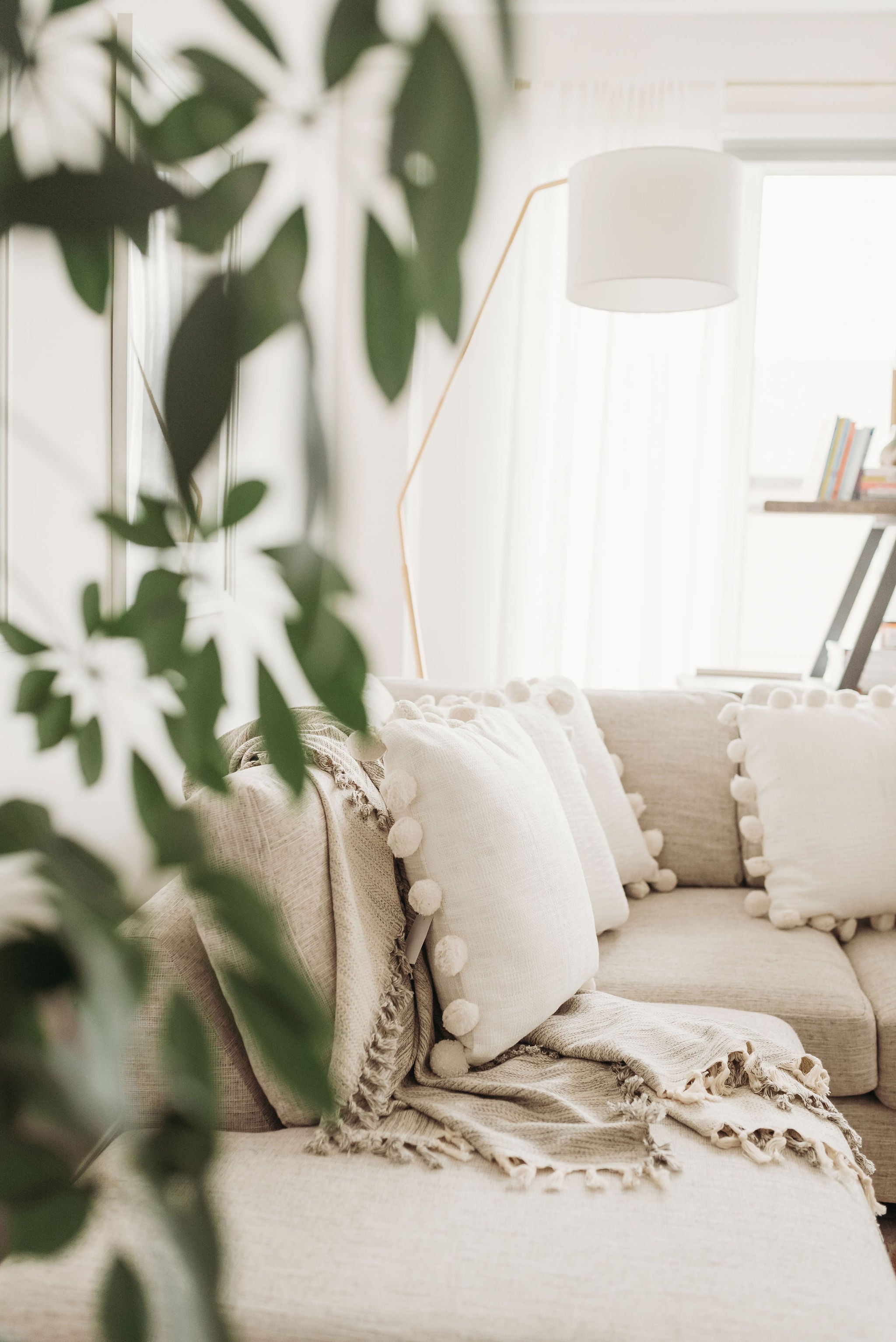 POM POM throw pillows on a couch