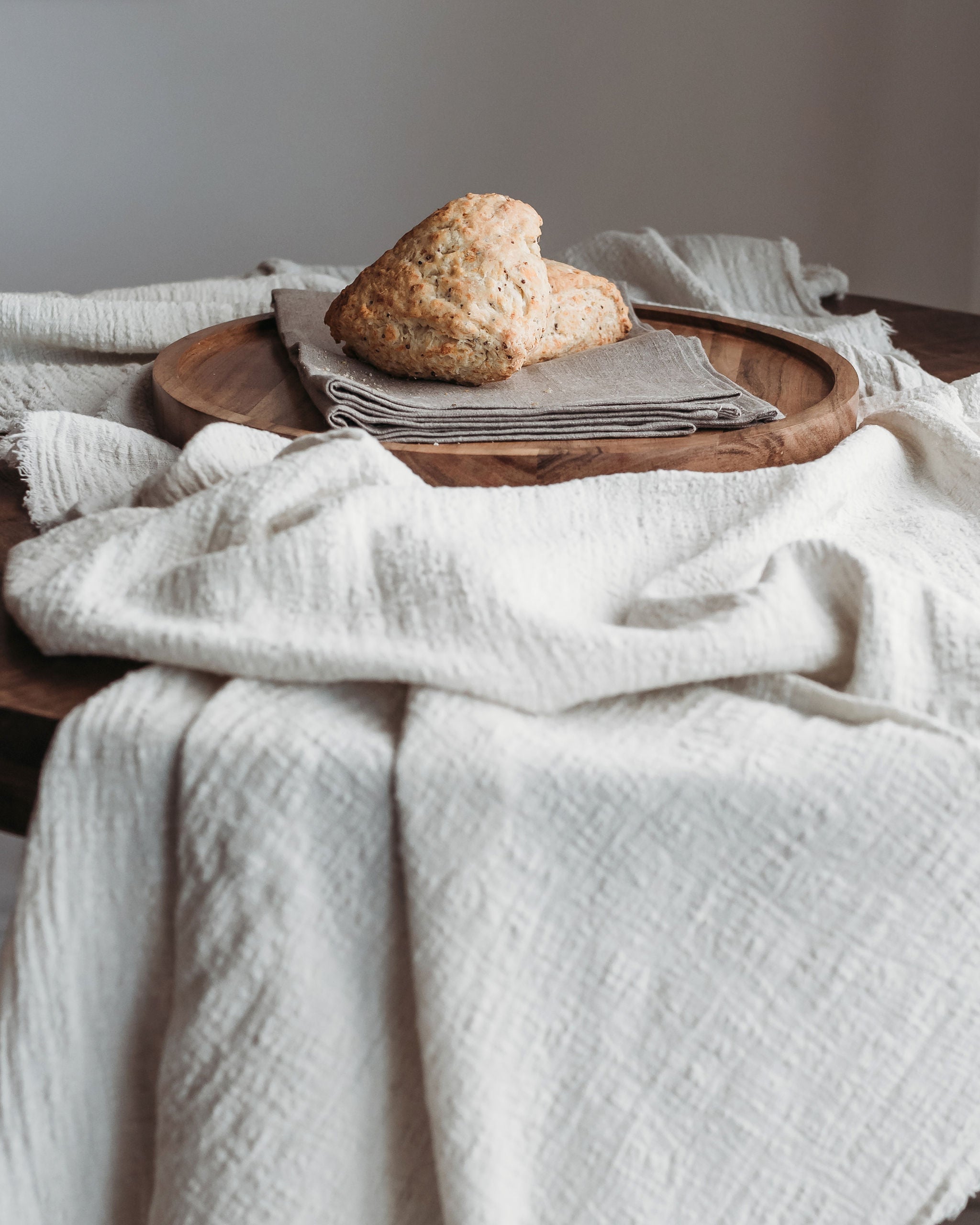 Scones on a tray on a table runner